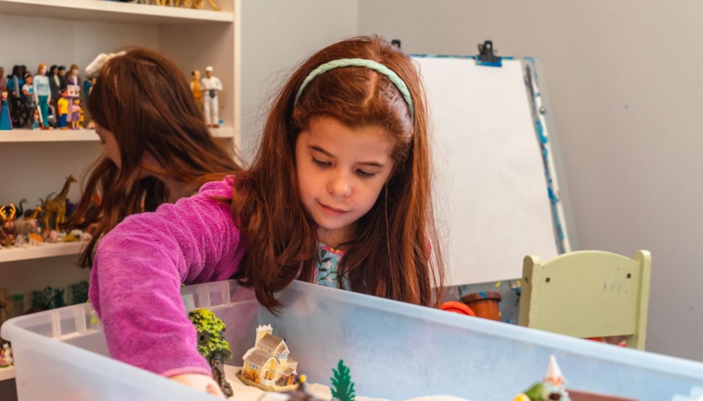 a-girl-plays-in-a-sandbox