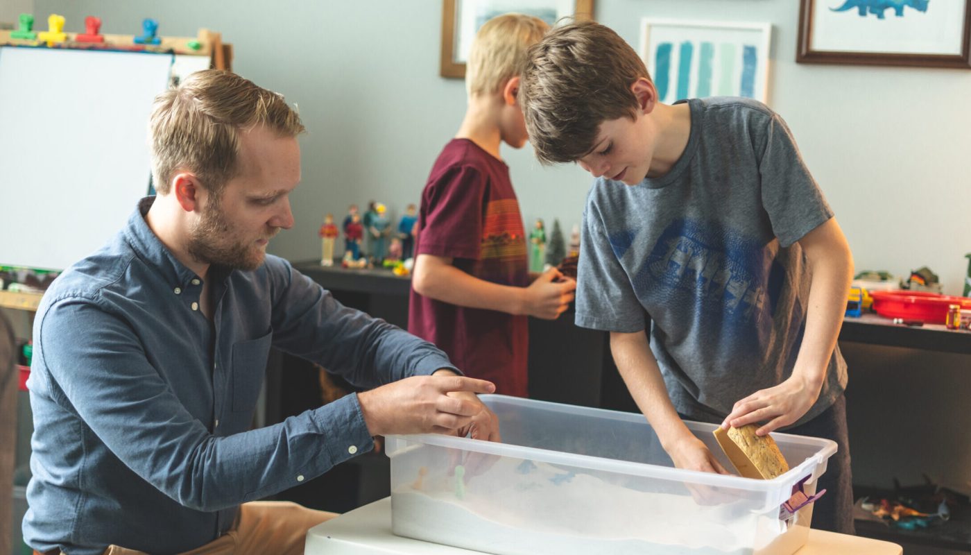 Nik_Johnson_Playing_and_talking_with_Kids_in_Playroom_with_Sandtray